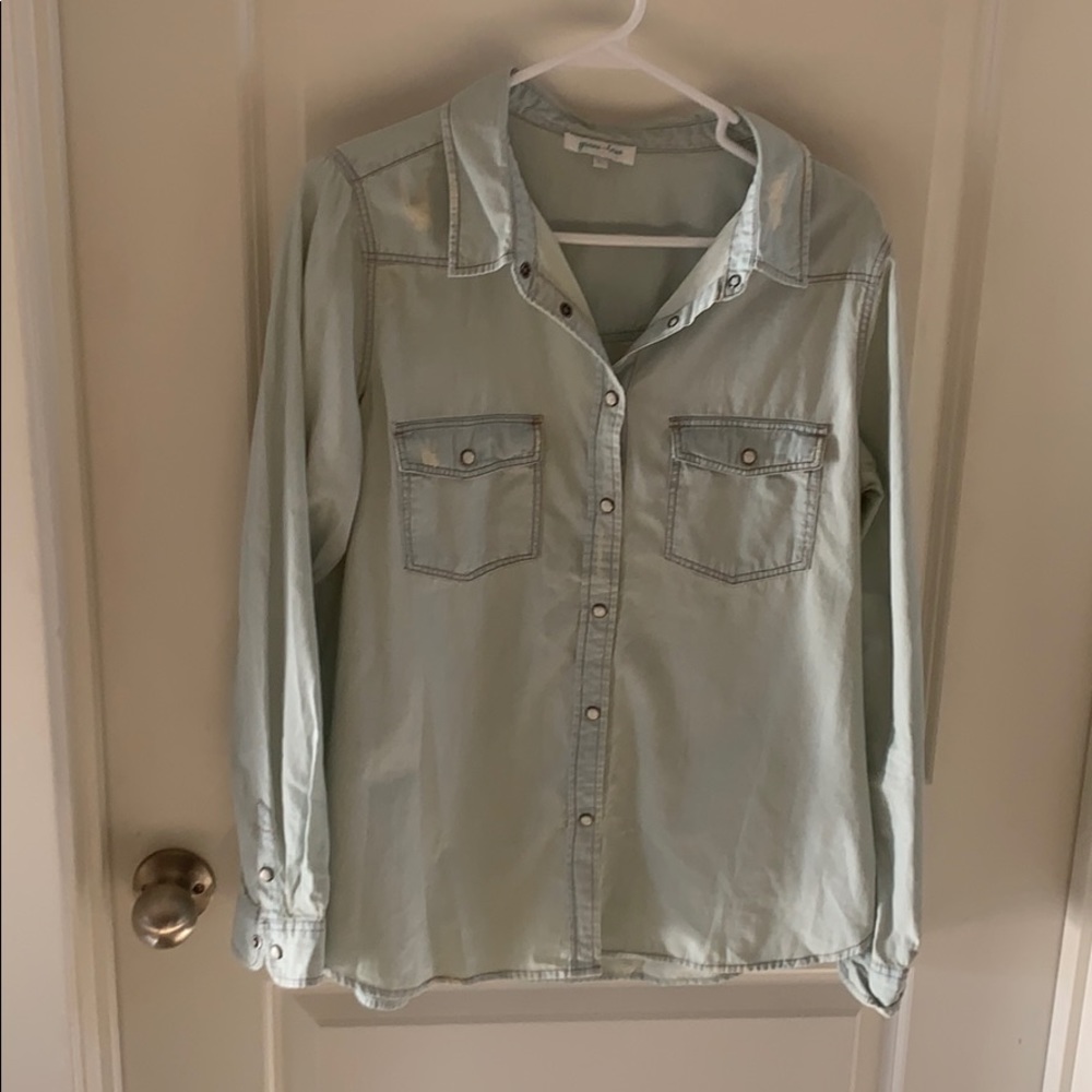 Women’s pearl snap light wash jean button down
